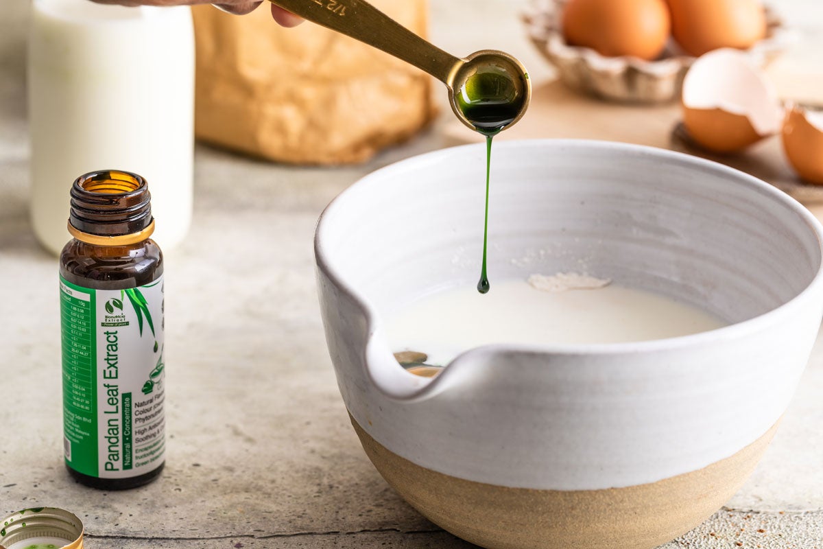 Pandan extract being added to batter