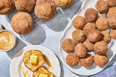 Maple French Toast Mini Muffins arranged on plates on a counter. - select to zoom