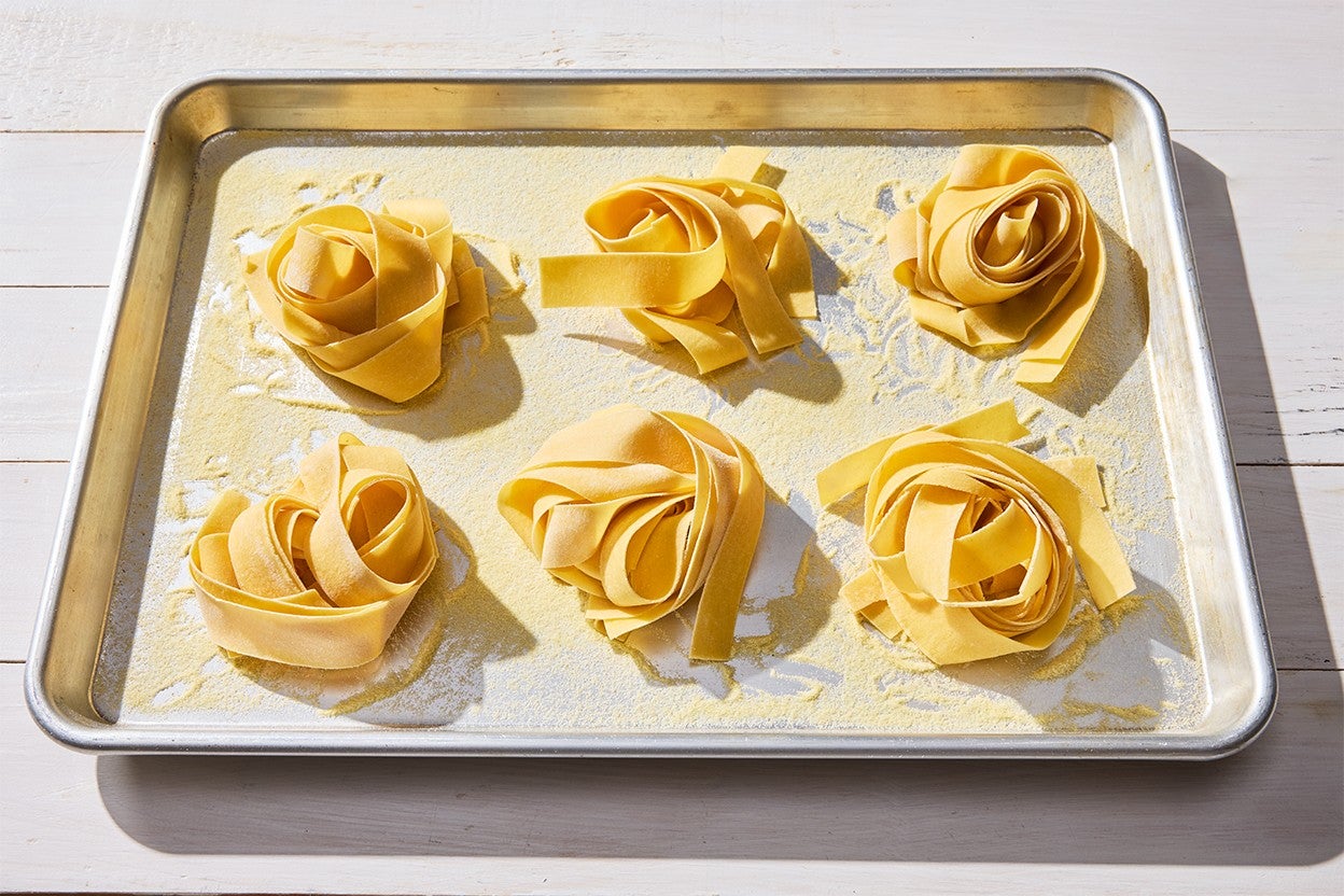 Fresh Pasta nests on a baking sheet